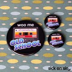 An original design of a retro cassette tape with the text Woo Me Old School. A cute design by Sick On Sin available on pins, magnets, keychains, etc.
