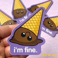 A hand holding a die cut vinyl sticker of a smiling upside down chocolate ice cream cone with the text I'm Fine by Sick On Sin