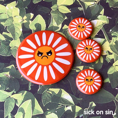 A collection of flair pieces featuring a simple design of an angry daisy. A cute original design by Sick On Sin available on pins, magnets, keychains, etc