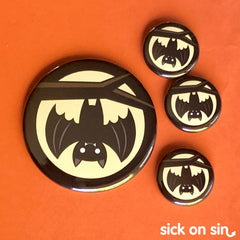 A cute vampire bat hanging upside down in the moonlight. An original design by Sick On Sin available on pins, magnets, keychains, etc.