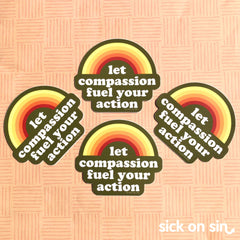 A group of die cut stickers featuring a retro coloured rainbow and the slogan 'let compassion fuel your action'.  A cute original design by Sick On Sin.