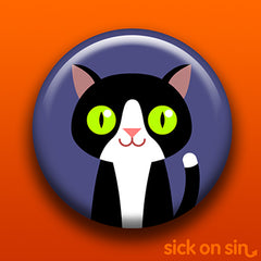 Illustration of a cute black and white tuxedo cat with big green eyes. Original design by Sick On Sin available on pins, magnets, keychains, etc.